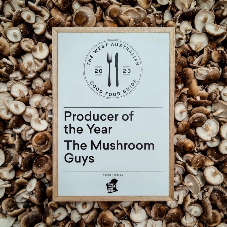 "Producer of the Year" award for The Mushroom Guys, displayed on a bed of fresh shiitake mushrooms in Perth, Western Australia.